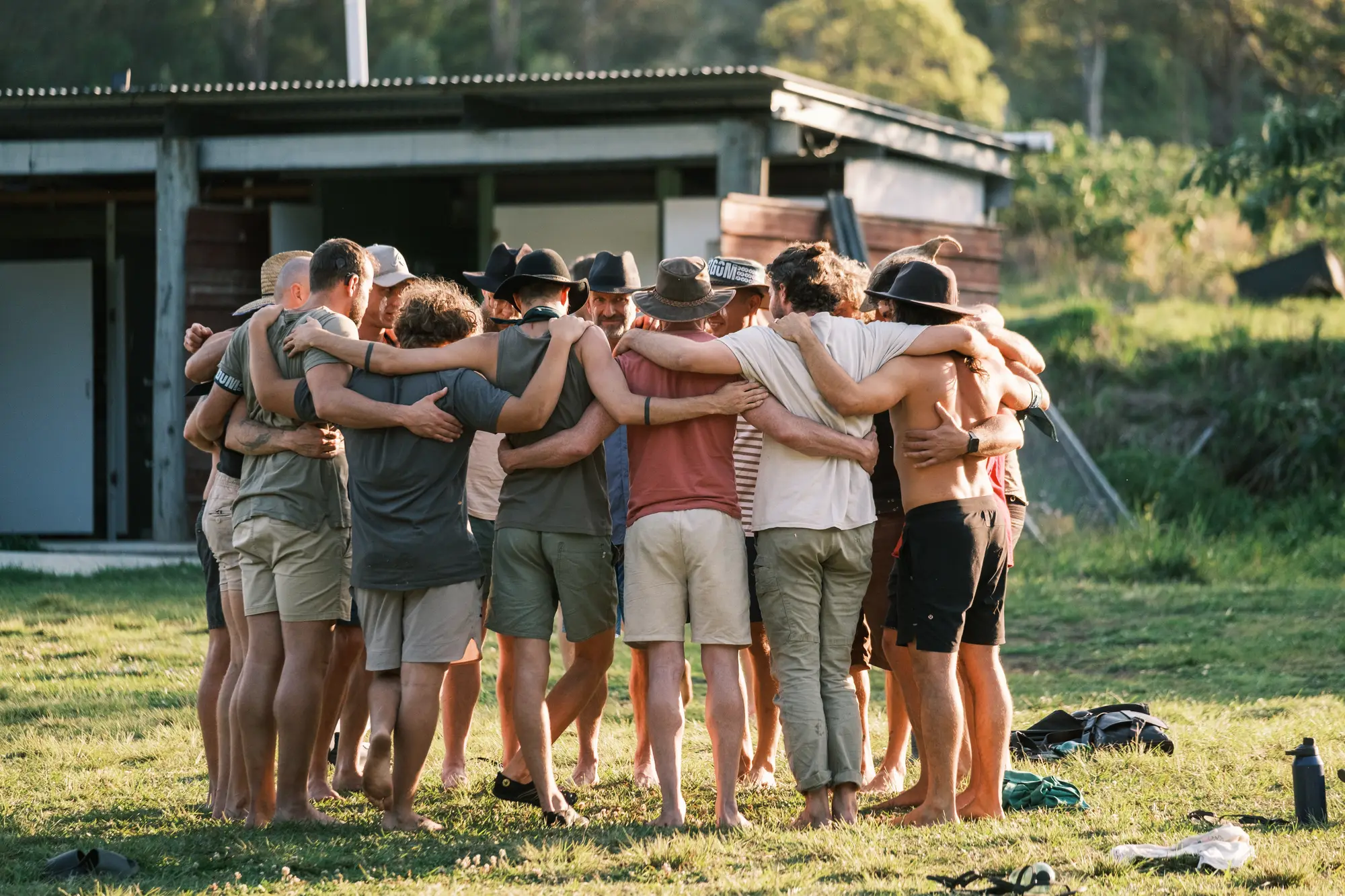 Men shoulder to shoulder in the golden light at The Gathering of Men